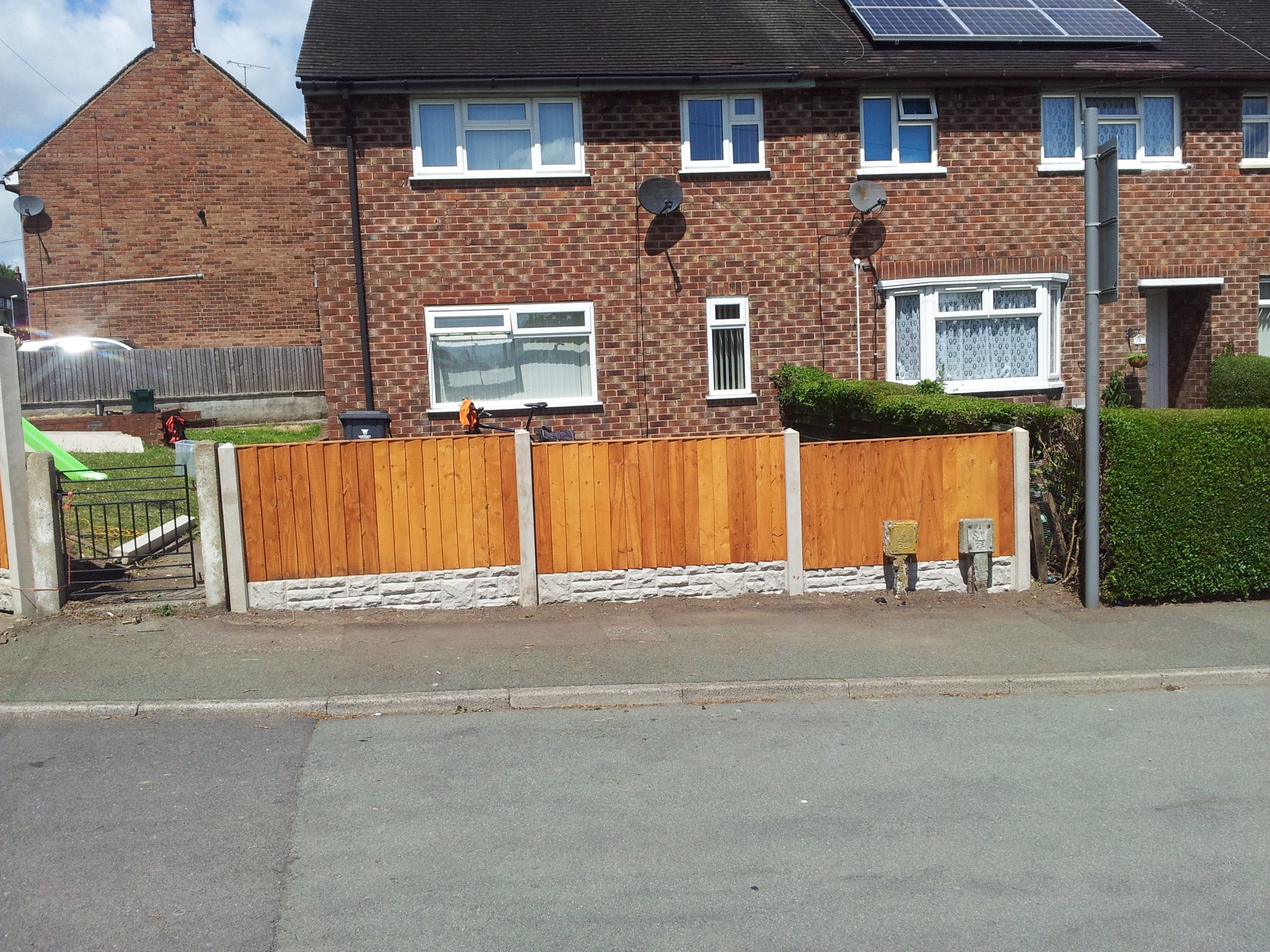 New panel fence on concrete posts in its place